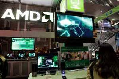Advanced Micro Devices booth shown at the Consumer Electronics Shows in Las Vegas, Jan. 9, 2008. Advanced Micro Devices Inc. is expected to report first-quarter financial results after the market closes Thursday, April 17, 2008. (AP Photo/Paul Sakuma)