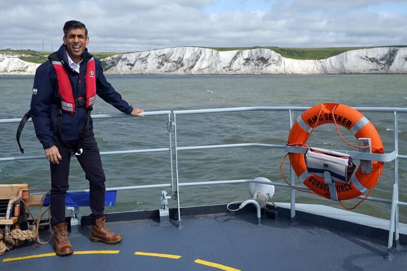 Rishi Sunak onboard a Border Agency boat as he pledged to keep tackle the issue of small boats. PA