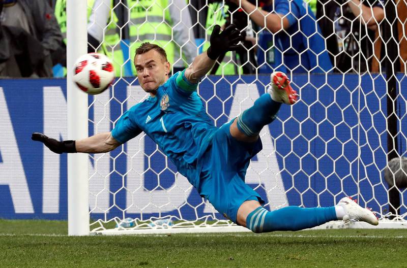 epaselect epa06855824 Goalkeeper Igor Akinfeev of Russia saves the last penalty during the penalty shootout of the FIFA World Cup 2018 round of 16 soccer match between Spain and Russia in Moscow, Russia, 01 July 2018.

(RESTRICTIONS APPLY: Editorial Use Only, not used in association with any commercial entity - Images must not be used in any form of alert service or push service of any kind including via mobile alert services, downloads to mobile devices or MMS messaging - Images must appear as still images and must not emulate match action video footage - No alteration is made to, and no text or image is superimposed over, any published image which: (a) intentionally obscures or removes a sponsor identification image; or (b) adds or overlays the commercial identification of any third party which is not officially associated with the FIFA World Cup)  EPA/SERGEI CHIRIKOV   EDITORIAL USE ONLY