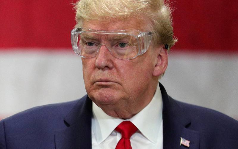 U.S. President Donald Trump wears protective glasses as he tours a Honeywell facility manufacturing protective face masks for the coronavirus disease (COVID-19) pandemic in Phoenix, Arizona, U.S., May 5, 2020. REUTERS/Tom Brenner     TPX IMAGES OF THE DAY