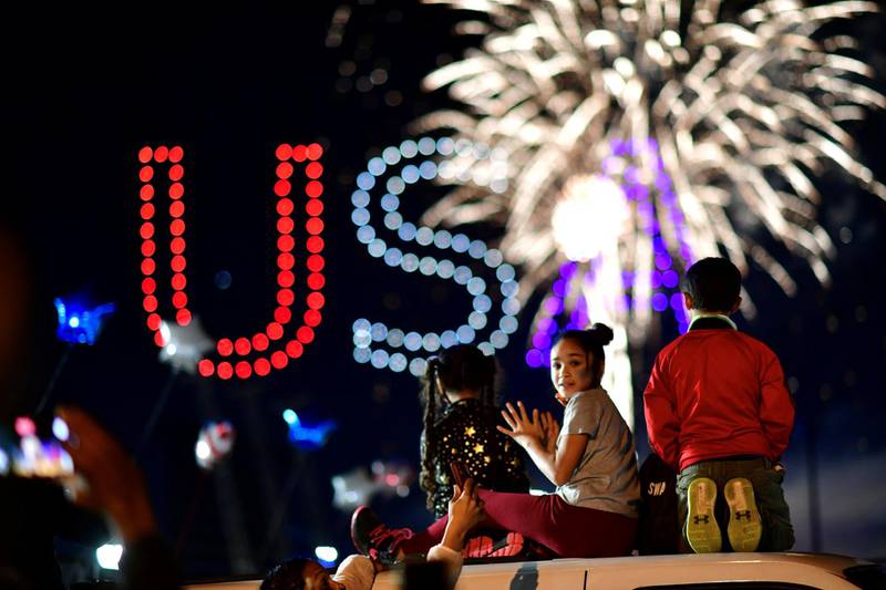 People watch fireworks after media announced that Democratic US presidential candidate Joe Biden has won the 2020 election, in Wilmington, Delaware. Reuters