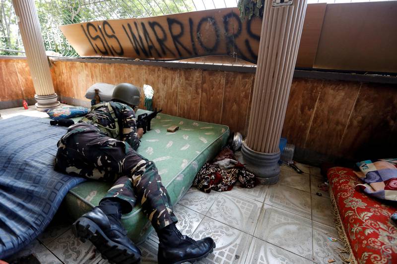 FILE PHOTO: A Filipino soldier lies on a mattress at their combat position in a house as government troops continue their assault against insurgents from the Maute group in Marawi city, Philippines July 1, 2017. REUTERS/Jorge Silva/File Photo