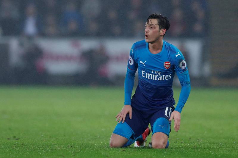Soccer Football - Premier League - Swansea City vs Arsenal - Liberty Stadium, Swansea, Britain - January 30, 2018   Arsenal's Mesut Ozil looks dejected      Action Images via Reuters/Andrew Couldridge    EDITORIAL USE ONLY. No use with unauthorized audio, video, data, fixture lists, club/league logos or "live" services. Online in-match use limited to 75 images, no video emulation. No use in betting, games or single club/league/player publications.  Please contact your account representative for further details.