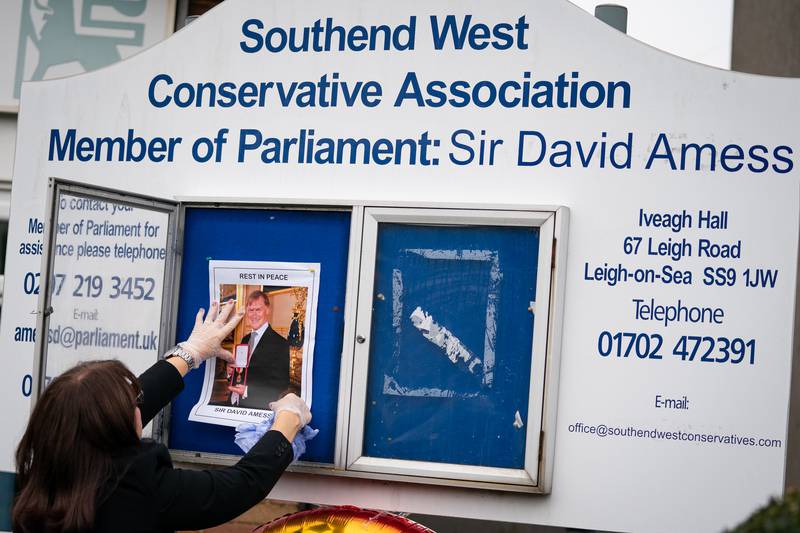 A photograph of Sir David Amess is placed on a noticeboard outside the Iveagh Hall, the home of the Southend West Conservative Association in Leigh-on-Sea. AP