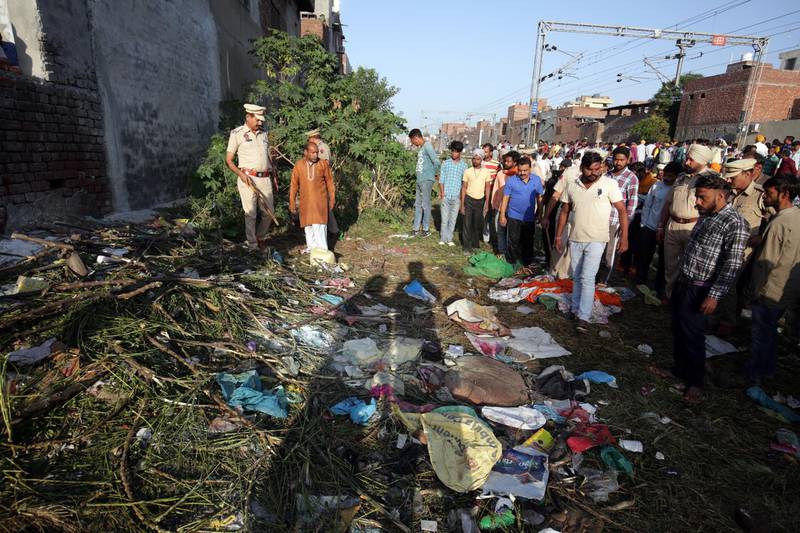 epa07106377 Police officers inspect at the site of a train accident in Amritsar, India, 20 October 2018. According to reports, at least 60 people were killed when a train ran over a crowd that was watching the burning of Ravana effigy during Dusshera celebrations on 19 October 2018.  EPA/RAMINDER PAL SINGH