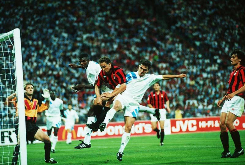 May 1993:  Jean-Pierre Papin of Milan is challenged by marcel Desailly and Jean-Christophe Thomas of Marseille during the European Cup Final played between AC Milan and Marseille at the Olympic Stadium, Munich. Marseille won the match 1-0. Mandatory Credit: Shaun Botterill/Getty Images