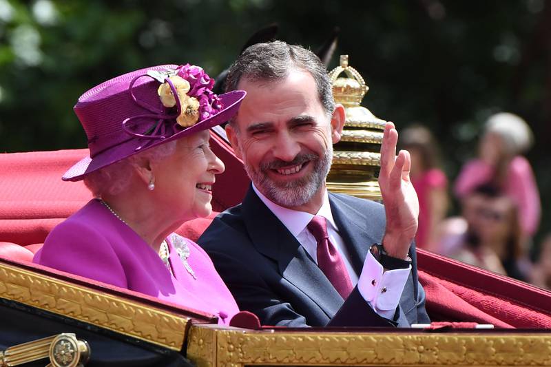 Queen Elizabeth II and King Felipe VI travel in a state carriage along The Mall in central London on the first day of the three day state visit.