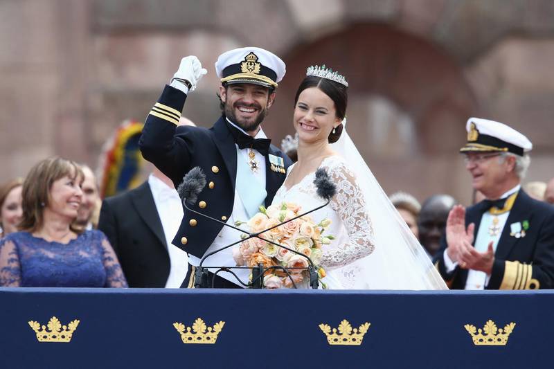 STOCKHOLM, SWEDEN - JUNE 13:  Prince Carl Philip of Sweden and HRH Princess Sofia, Duchess of Varmlands salute the crowd after their marriage ceremony on June 13, 2015 in Stockholm, Sweden.  (Photo by Andreas Rentz/Getty Images)