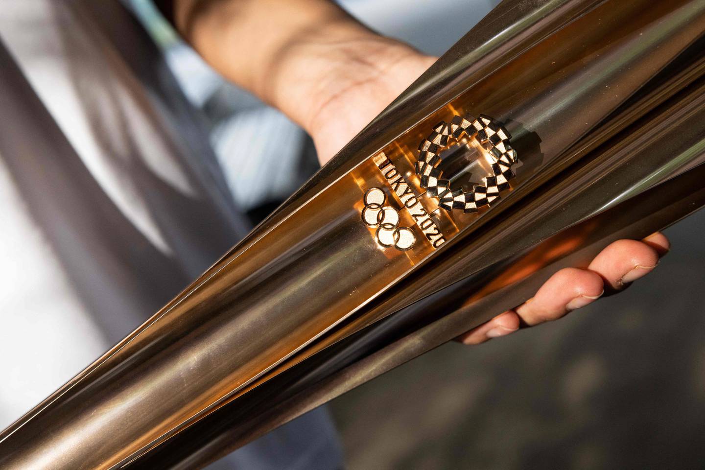 The rose-gold Olympic torches are made using recycled aluminium. AFP