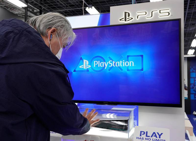 A man looks at the new Sony PlayStation 5 console at a store in Tokyo, Japan. EPA