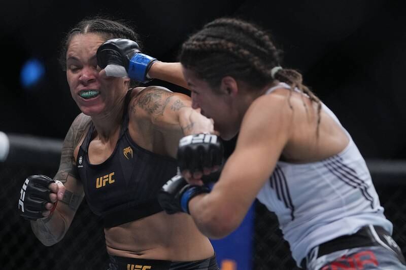 Julianna Pena moves in with a hit against Amanda Nunes. Reuters
