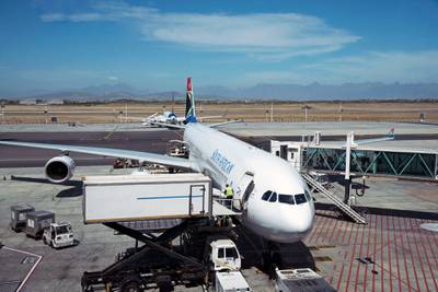 Catering supply truck supply an passenger jet aircraft at Cape Town International Airport. (Photo by: Education Images/UIG via Getty Images)