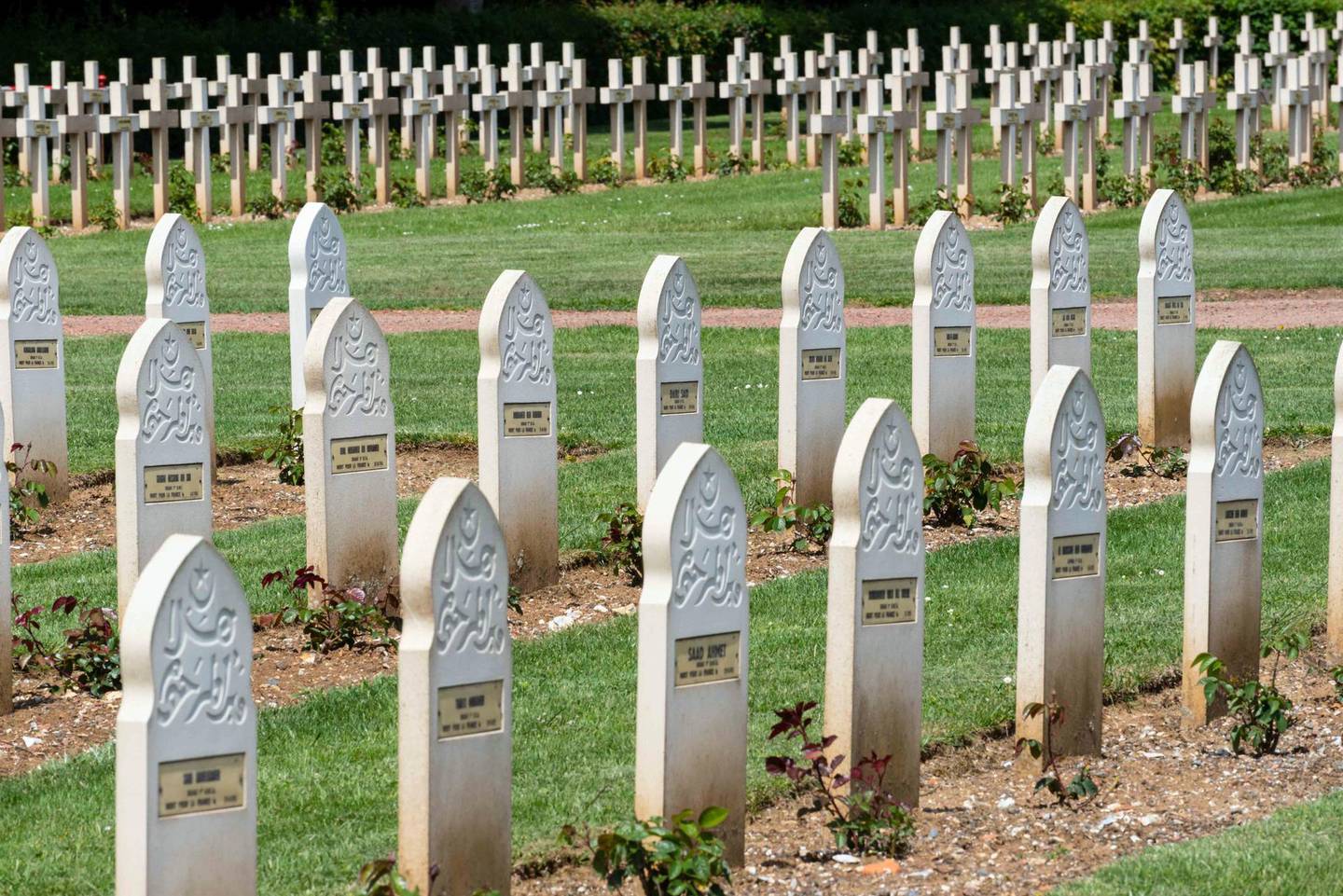 Muslim headstones from the First World War in Notre Dame de Lorette French national cemetery. In the background are Christian headstones. David Crossland / The National