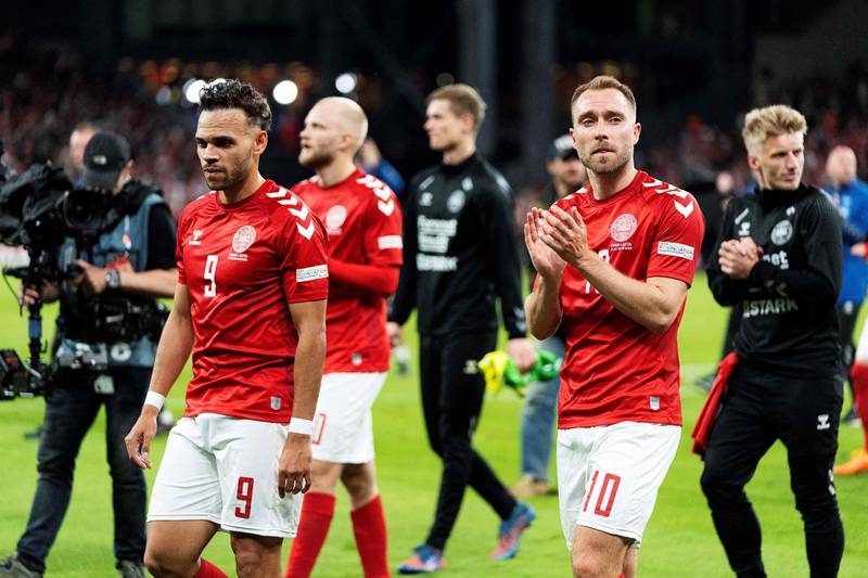 Denmark midfielder Christian Eriksen, right, celebrates his team's 2-0 Nations League - League A Group 1 win over Austria at the Parken Stadium in Copenhagen on June 13, 2022.  AFP