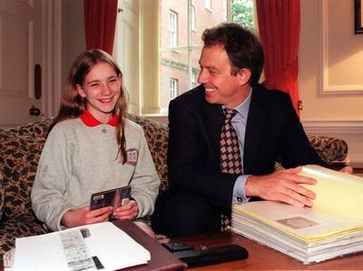 Mr Blair and a Belfast schoolgirl, Margaret Gibney, inside 10 Downing Street in June 1997. Ms Gibney had become popular around the world after she asked Mr Blair to bring peace to Northern Ireland. PA