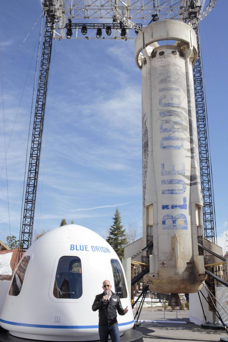 Jeff Bezos, chief executive officer of Amazon.com Inc. and founder of Blue Origin LLC, speaks at the unveiling of the Blue Origin New Shepard system during the Space Symposium in Colorado Springs, Colorado, U.S., on Wednesday, April 5, 2017. Bezos has been reinvesting money he made at Amazon since he started his space exploration company more than a decade ago, and has plans to launch paying tourists into space within two years. Photographer: Matthew Staver/Bloomberg
