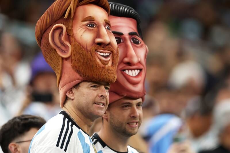 Argentina fans support two of the team's best players: Lionel Messi and Angel Di Maria. Getty Images