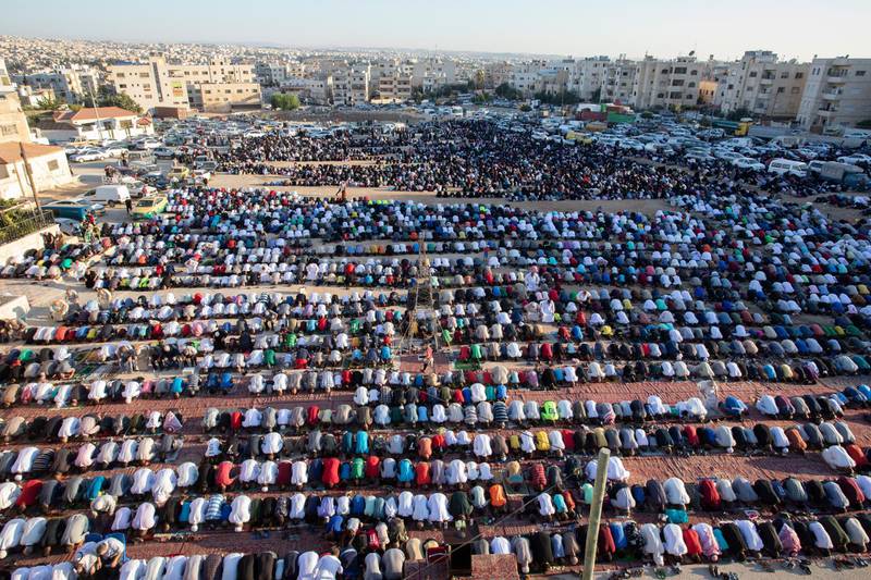 Muslims perform the Eid Al Adha morning prayer, in Amman, Jordan. EPA