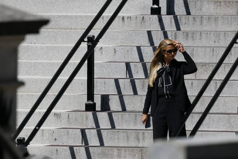 Celebrity Paris Hilton leaves the Eisenhower Executive Office Building in Washington. Bloomberg 