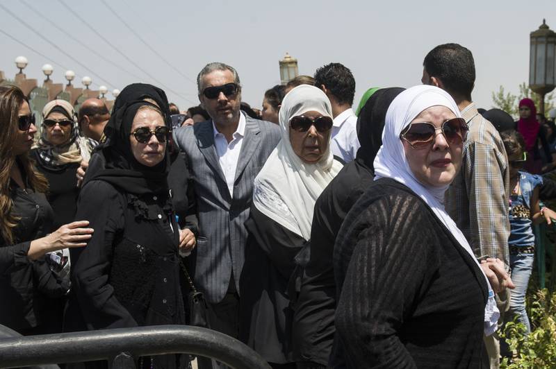 Egyptian actresses Shahera (left), Ragaa el-Geddawy (centre) and Dalal Abdelaziz (right) attend the funeral of Egyptian film star Nur al-Sharif on August 12, 2015
