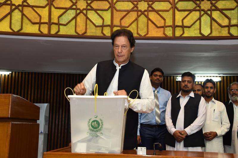 epa06996459 A handout photo made available by the Pakistani Press Information Department (PID) on 04 September 2018 shows Imran Khan, Prime Minister of Pakistan, casting his vote for the Presidential elections in Islamabad, Pakistan, 04 September 2018. Legislators in both chambers of the Pakistani parliament and the four provincial assemblies voted to elect the 13th president to replace Mamnoon Hussain. Dr. Arif Alvi, a leader of Pakistan Tahrik-e-Insaf political party that is ruling the country, and a candidate of the Presidential seat is expected to win the vote after his party's victory in the July general elections, which saw the party's leader, Imran Khan, become prime minister.  EPA/PRESS INFORMATION DEPARTMENT HANDOUT  HANDOUT EDITORIAL USE ONLY/NO SALES