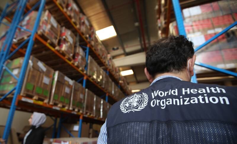 Employees from International Humanitarian City and the World Humanitarian Organisation gather while uploading aid and relief goods for the victims of the Afghanistan earthquake, in Dubai in June 2022.  EPA 