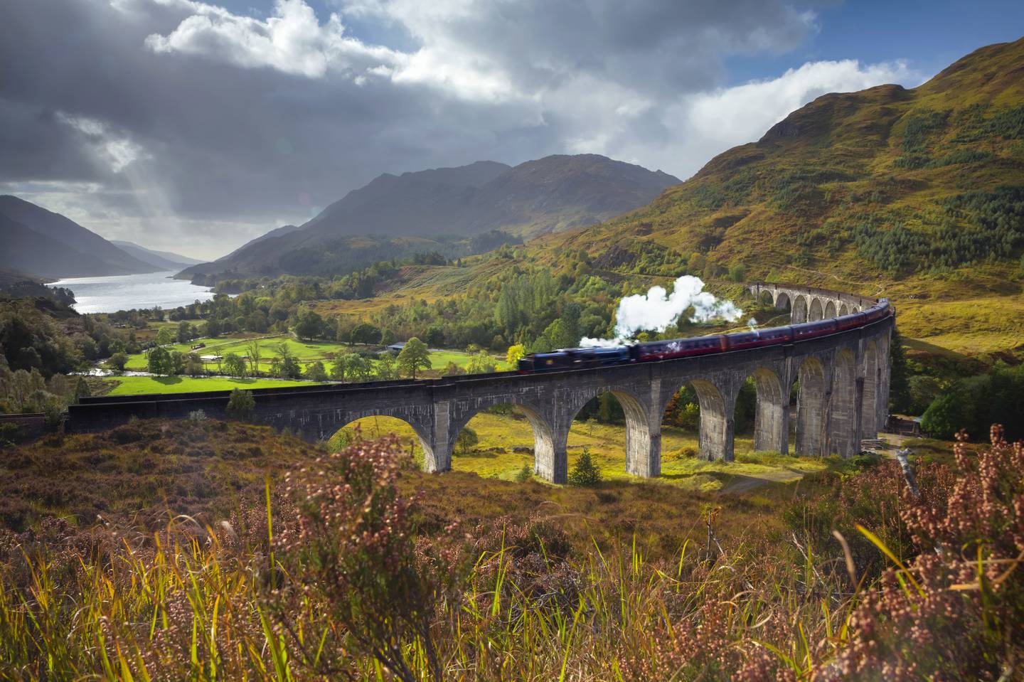 UK, Scotland, Highland, Loch Shiel, Glenfinnan, Glenfinnan Railway Viaduct, part of the West Highland Line, The Jacobite Steam Train, made famous in JK Rowling's Harry Potter as the Hogwarts Express. Getty Images