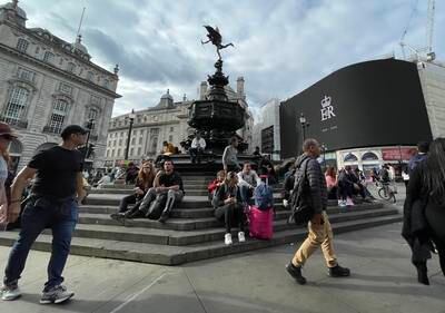 A giant screen honouring the late queen at Piccadilly Circus in London. EPA