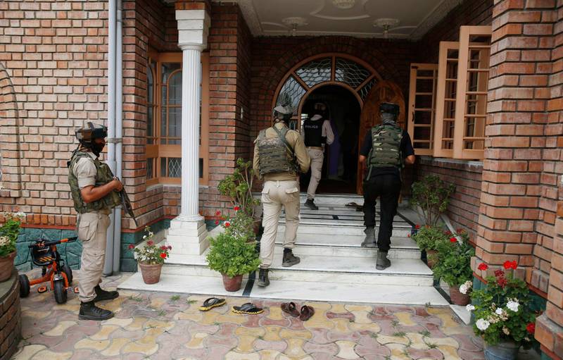 Indian policemen enter homes in Kashmir searching for Anti-India rebels accused of firing on a police convoy in Srinagar, EP