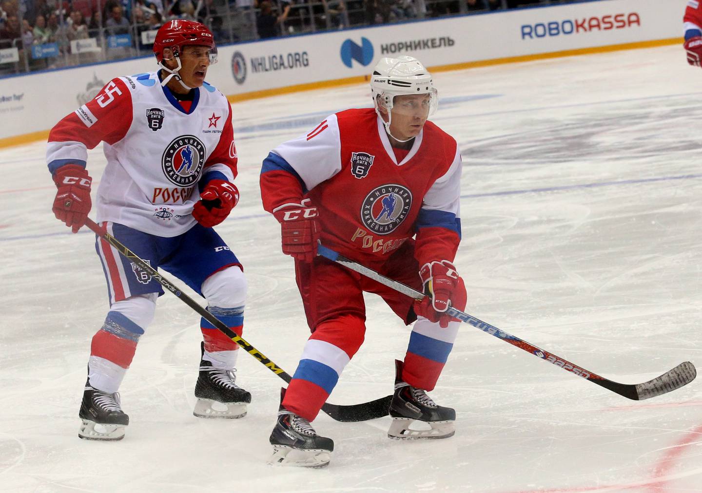 Russian President Vladimir Putin, right, and billionaire businessman Boris Rotenberg play ice hockey in Sochi, Russia, in 2017. Getty Images