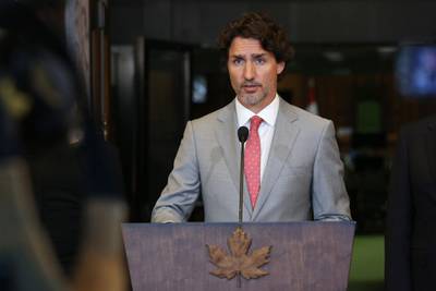 (FILES) In this file photo taken on August 18, 2020 Canada's Prime Minister Justin Trudeau speaks during a news conference on Parliament Hill in Ottawa, Canada. Despite US President Joe Biden's scrapping of an oil pipeline important to Canada, Prime Minister Justin Trudeau said on January 21, 2021 he looked forward to a renewed bilateral friendship and strong collaboration on the climate fight. / AFP / Dave Chan
