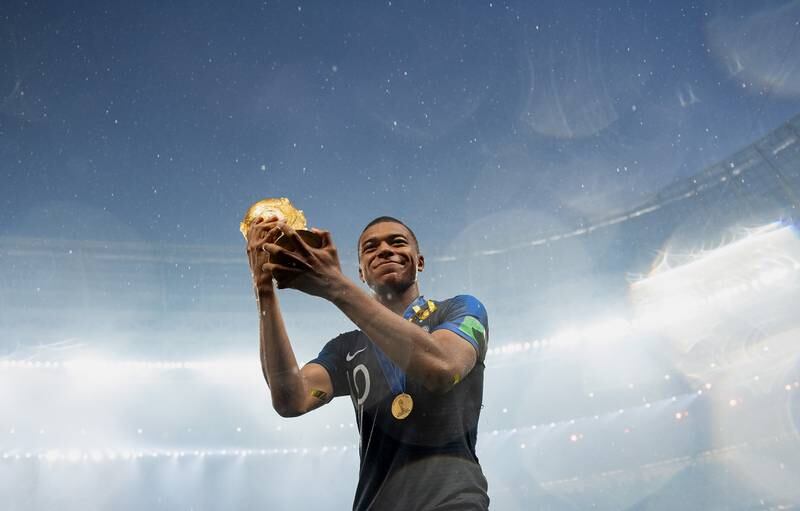 2018 World Cup, Russia. France's Kylian Mbappe celebrates with the trophy after his side's victory over Croatia at the Luzhniki Stadium in Moscow, Russia. Getty Images