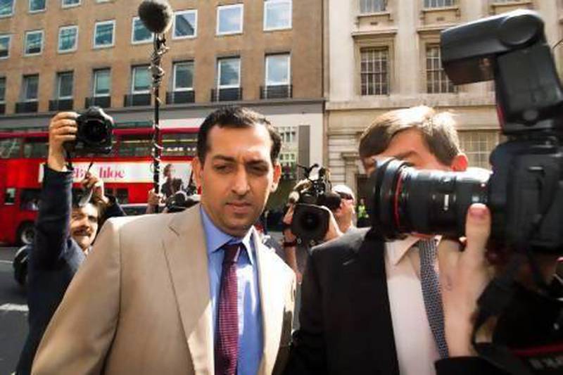 Godolphin trainer Mahmood Al Zarooni, left, found a sea of photographers waiting for him as he arrives to his disciplinary meeting with the British Horseracing Authority in London. Al Zarooni was later handed an eight-year ban for using banned substances on his horses.
