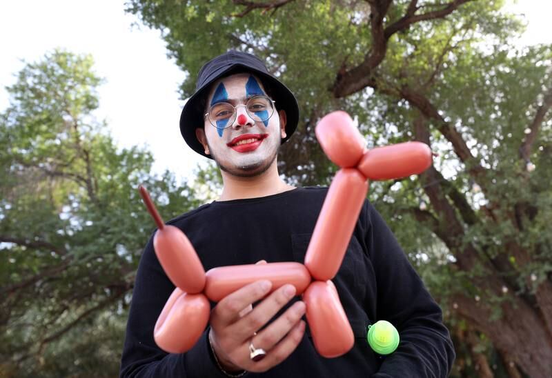 Muneeb creates balloon animals for guests at the Saturday Market