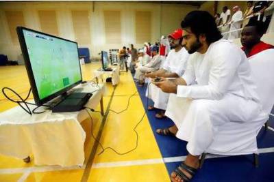 Contestants in the Million Player Playstation Football tournament in Dubai yesterday, all hoping to land the Dh1 million first prize . Satish Kumar / The National