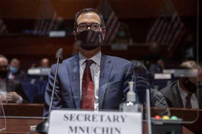 US Treasury Secretary Steven Mnuchin, wearing a face mask, prepares to testify before the House of Representatives Financial Services Committee in Washington this week. Reuters