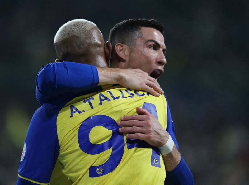 Cristiano Ronaldo celebrates with Anderson Talisca, who scored Al Nassr's winner against Al Ettifaq. Reuters