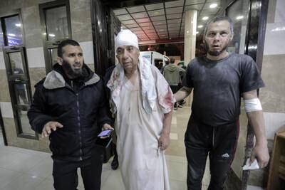Palestinians injured in air strikes arrive at Nasser Medical Hospital in Khan Younis, Gaza, on Saturday. Getty