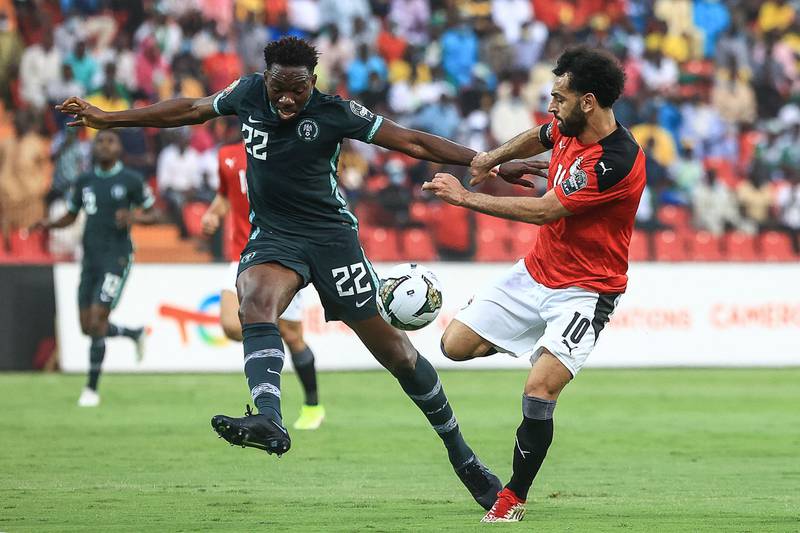 Egypt's Mohamed Salah battles for possession with Nigeria defender Kenneth Omeruo. AFP