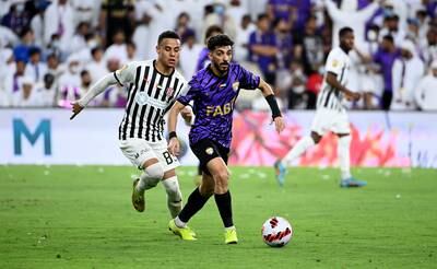 An Al Ain player, right, goes on the attack.
