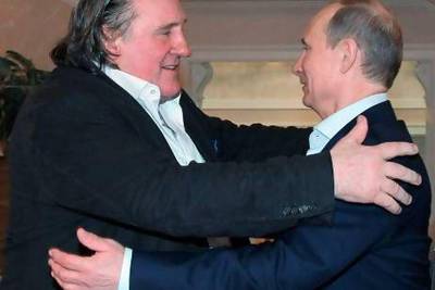 French actor Gerard Depardieu, left, greets Russian President Vladimir Putin after his arrival at Putin’s residence in Sochi.