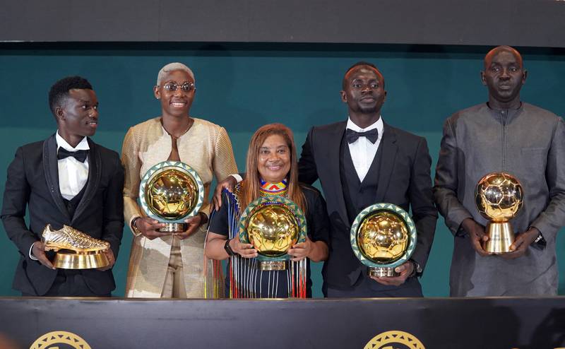 Senegal's Sadio Mane, left, after being crowned African Footballer of the Year award alongside the women's player of the year, Asisat Oshoala, and other award winners. Reuters