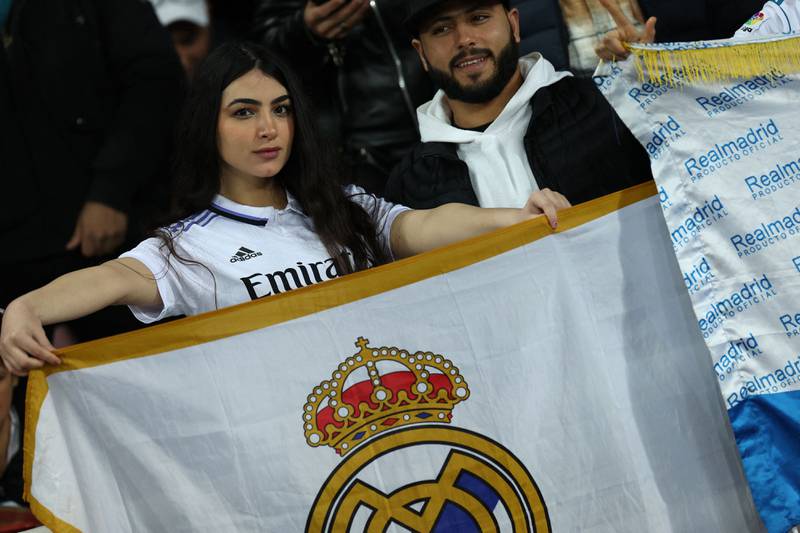 Real Madrid supporters hold a flag before kick-off at the Prince Moulay Abdellah Stadium. AFP