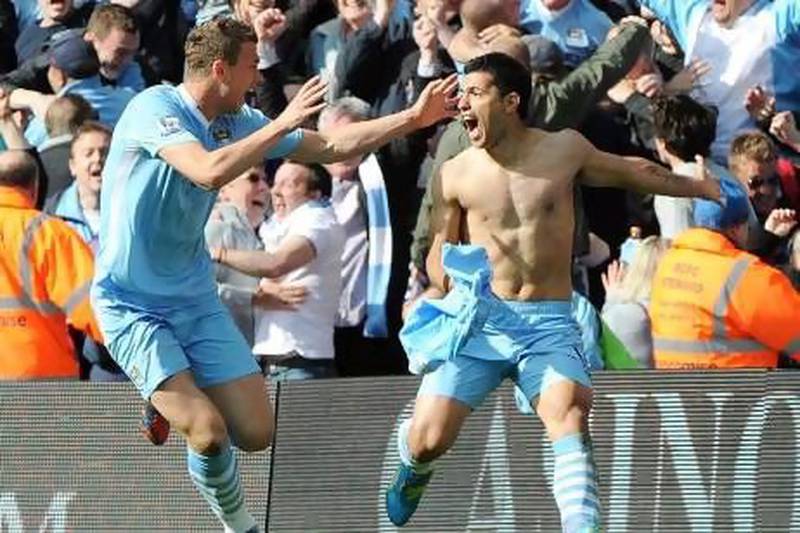 Sergio Aguero, right, and Edin Dzeko celebrate the winning goal just when it seemed everything was lost.