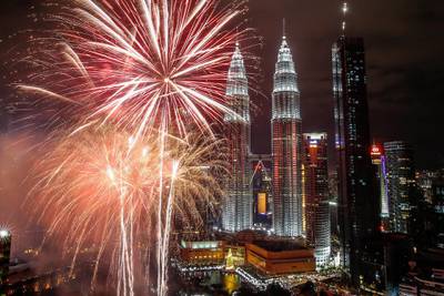 Fireworks illuminate the night sky over Malaysia's Petronas Towers during New Year's Eve celebrations in Kuala Lumpur. EPA