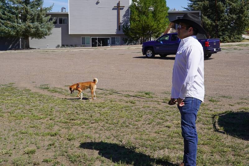 Evan Wagner and his dog Hiko travelled from Austin, Texas, to support Ms Cheney in Wyoming. 