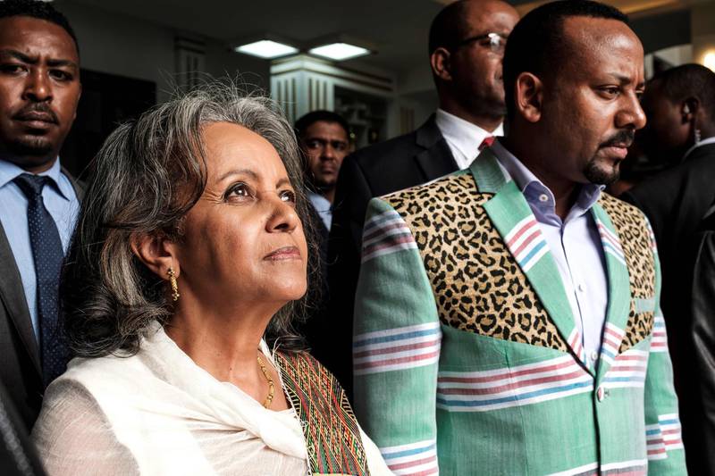 TOPSHOT - Sahle-Work Zewde (L) walks with Prime Minister Abiy Ahmed (R) after being elected as Ethiopia's first female President at the Parliament in Addis Ababa on October 25, 2018.  / AFP / EDUARDO SOTERAS
