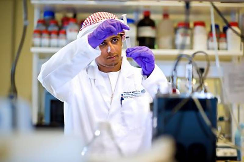 Masdar Institute student Ahmed Al Harithi at work on his research project exploring the potential for local strains of algae to produce biofuel. According to official sources, the UAE is moving towards potentially creating up to 100,000 jobs in the renewable energy sector by 2030 with attractive salaries. Mike Malate / Masdar Institute