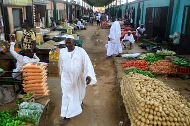 Sudanese vendors sell vegetables in the central market of Khartoum. AFP