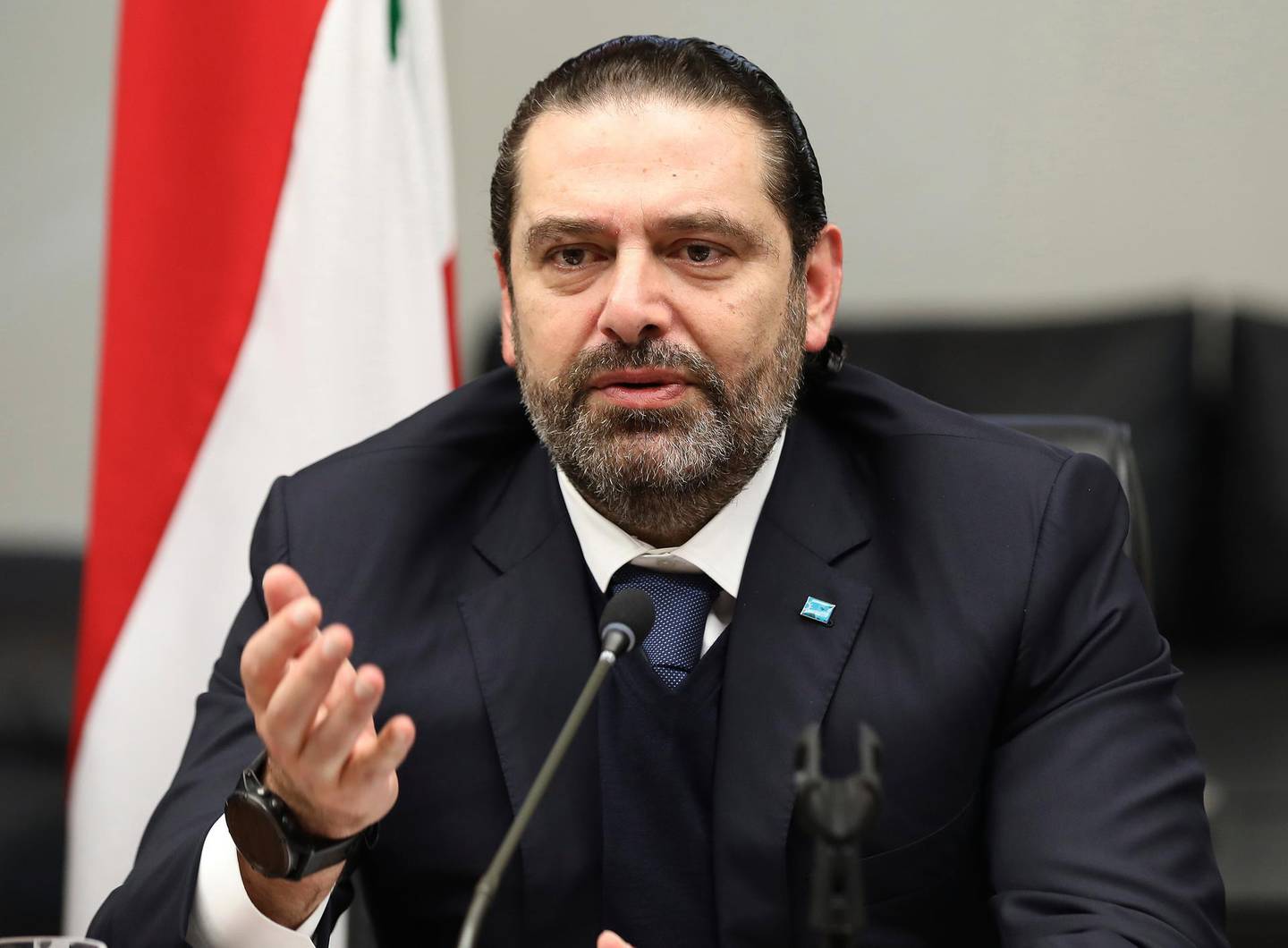 In this photo released by Lebanese government, Lebanese outgoing Prime Minister Saad Hariri gestures during his meeting with his parliamentary bloc, in Beirut, Lebanon, Thursday, Dec. 19, 2019. Lebanon's President Michel Aoun was holding long-delayed talks with parliamentary blocs Thursday to discuss the naming of a new prime minister amid an unprecedented political and economic crisis and weeks of nationwide protests roiling the country. (Dalati Nohra via AP)
